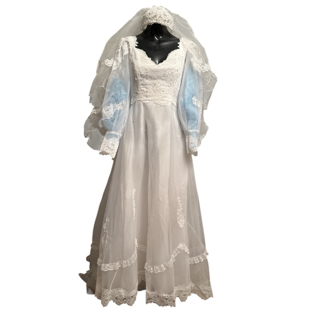 Vintage 1960s-70s wedding gown with veil, that was purchased as a preserved gown